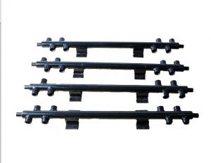 Set of fabricated mild steel low loss header manifolds with multiple threaded connections and mounting brackets.